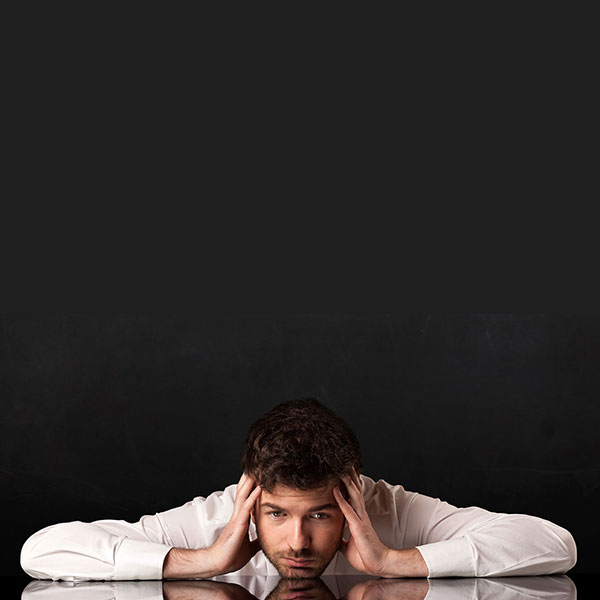unhappy lawyer sitting at desk